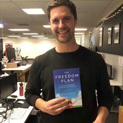 Reader holding The Freedom Plan (2)